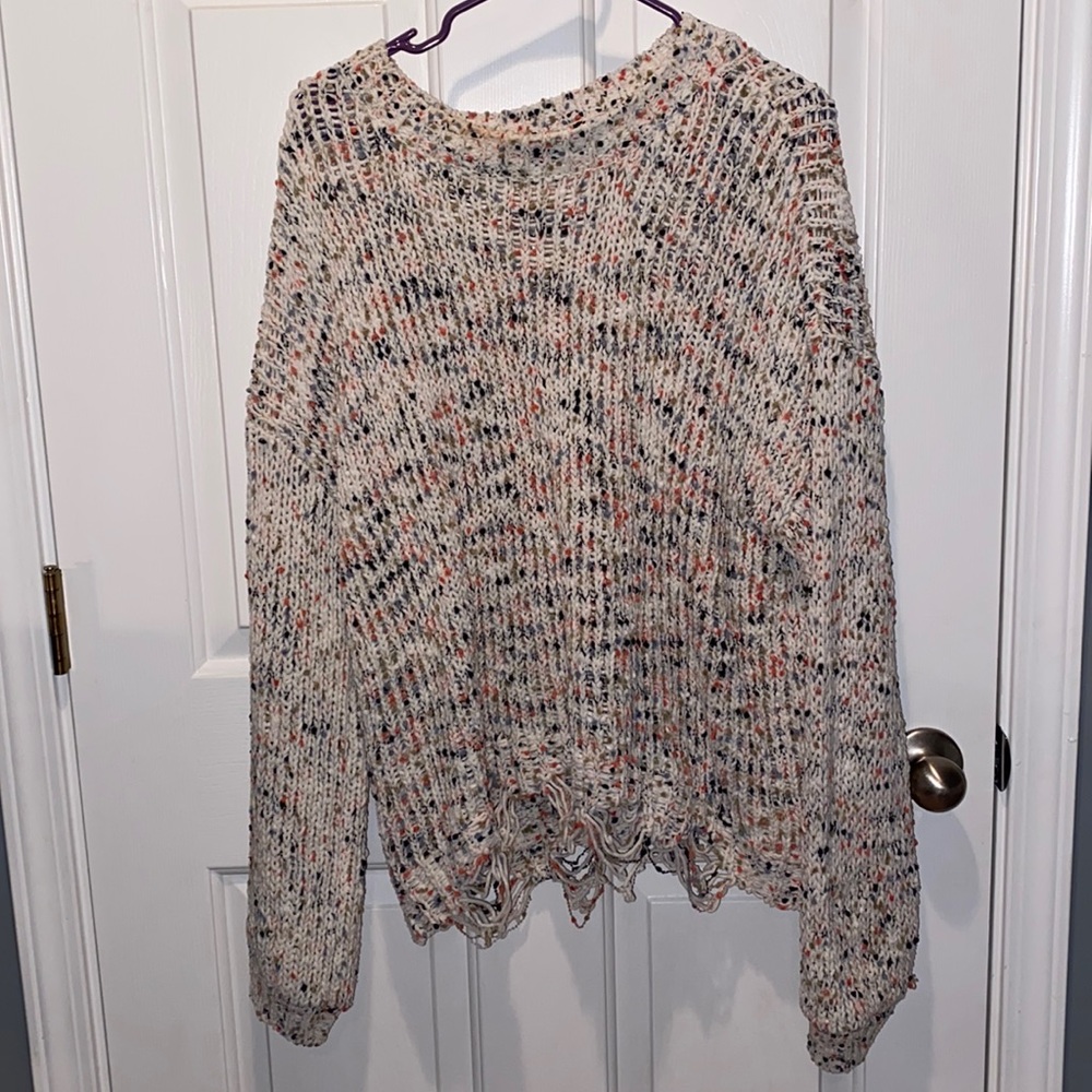 XL Rue 21 Multicolored sweater on cream background with frayed bottom